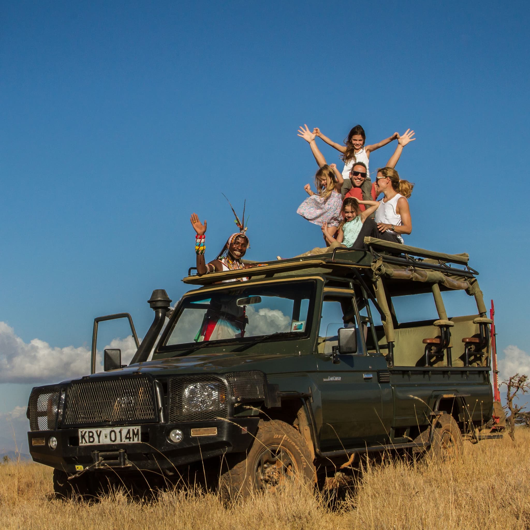 Family on jeep on safari at Lewa Wilderness